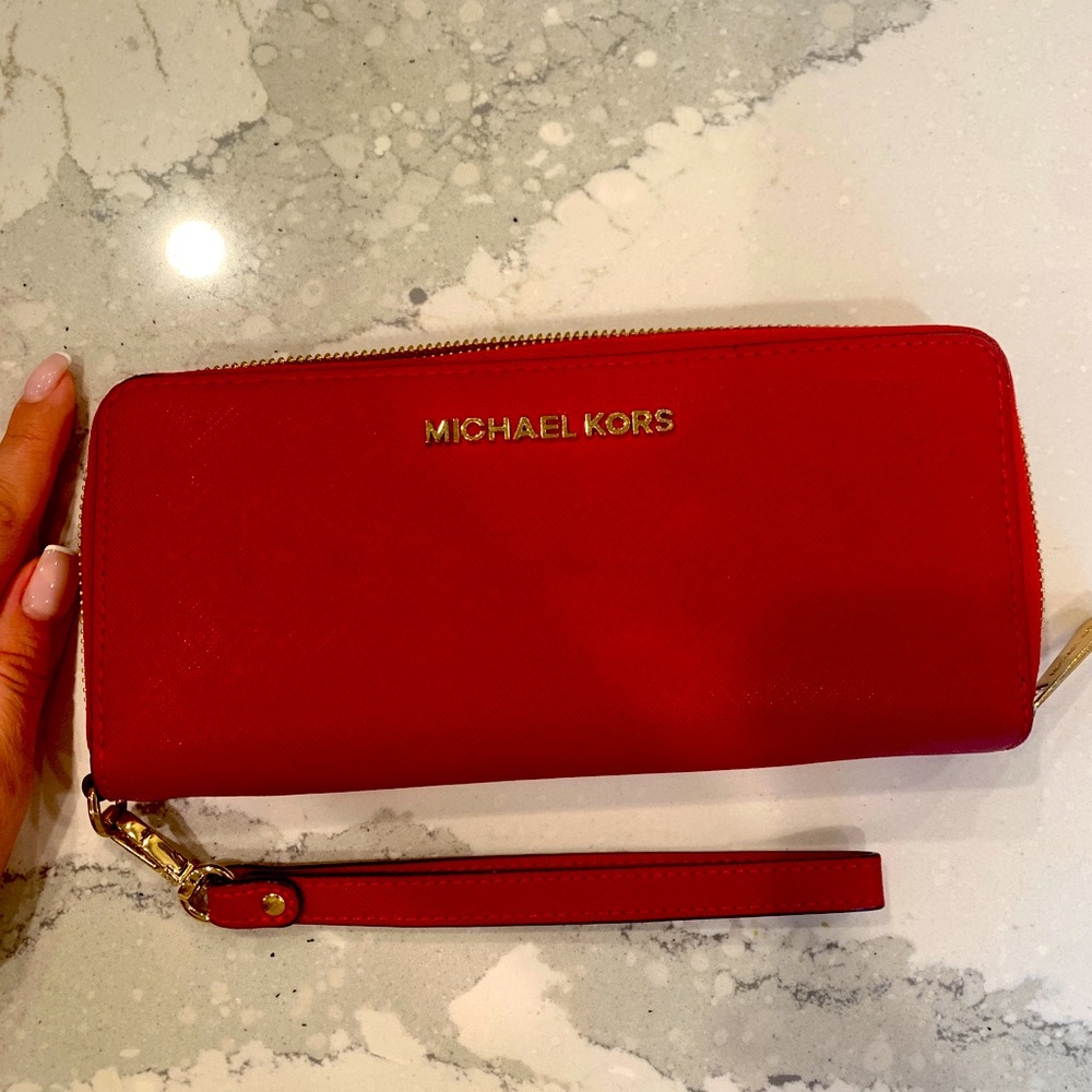 Michael Kors red wallet.